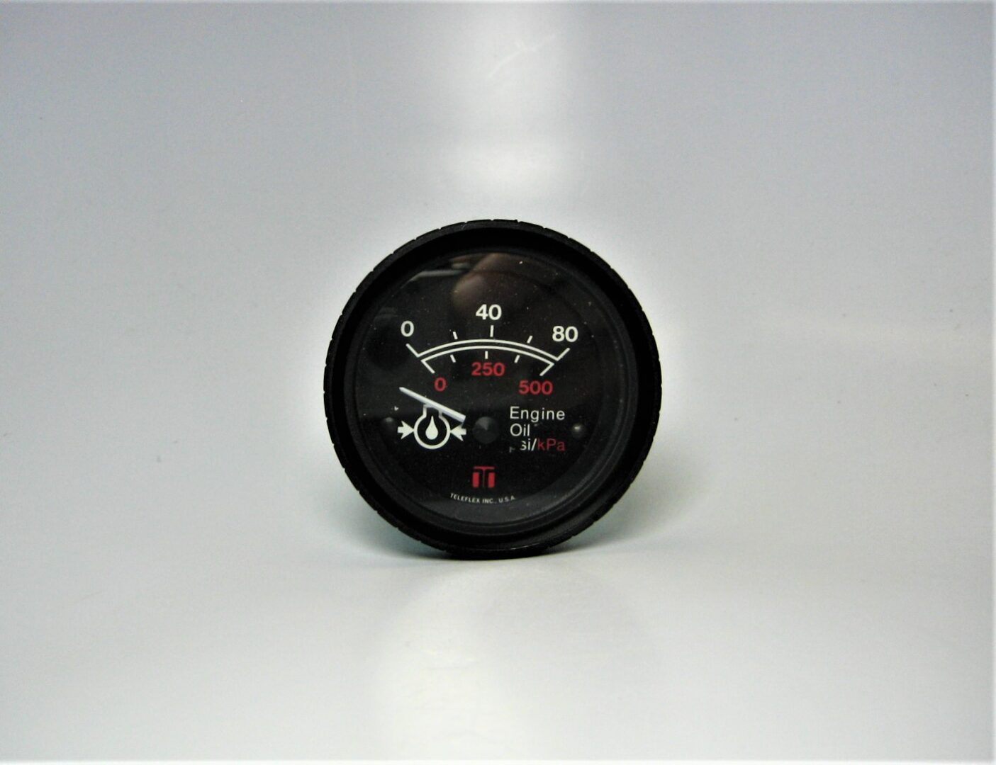 Teleflex Marine Oil Pressure Gauge 58180 - 2-1/4 Inch 12 Volt, 0-80 PSI, Halogen Illuminated, Black Bezel & White Face For Boats
